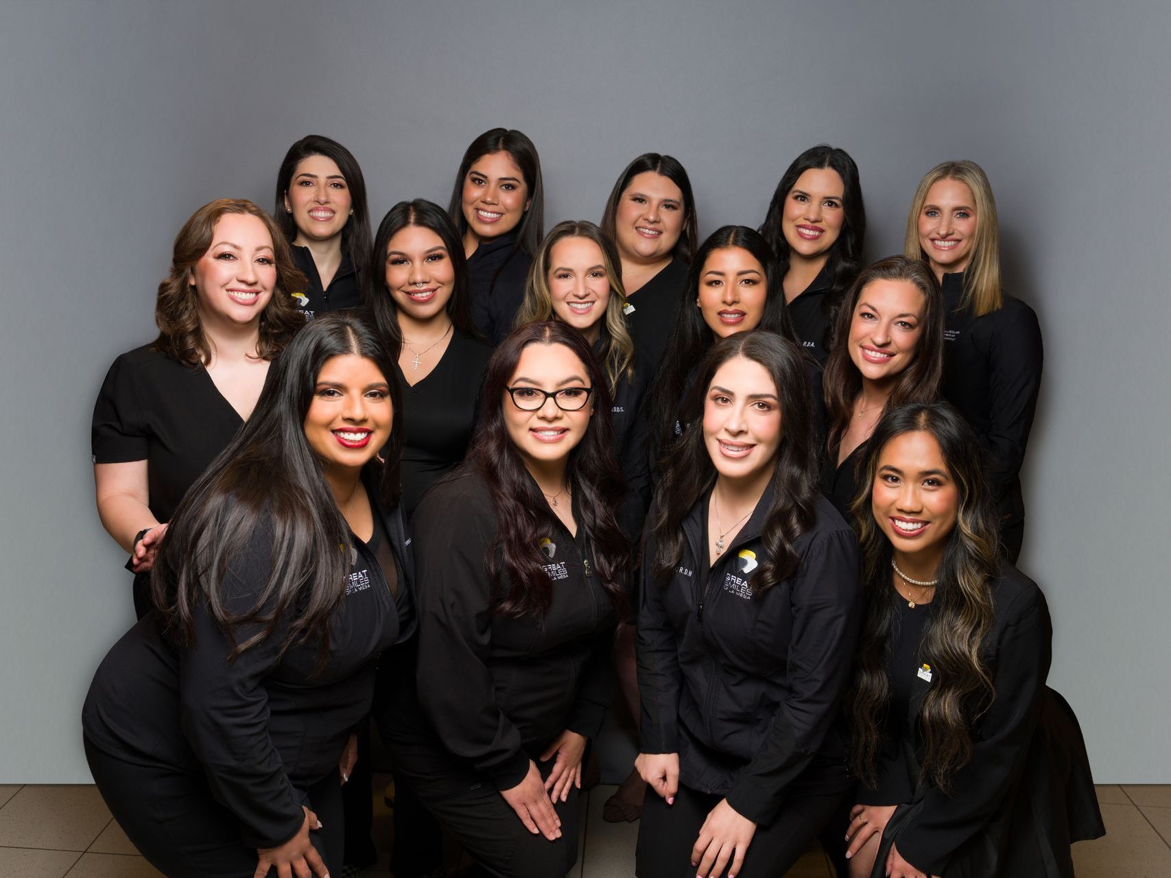 A group of women are posing for a picture together