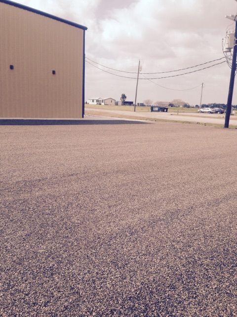A building with a lot of gravel in front of it
