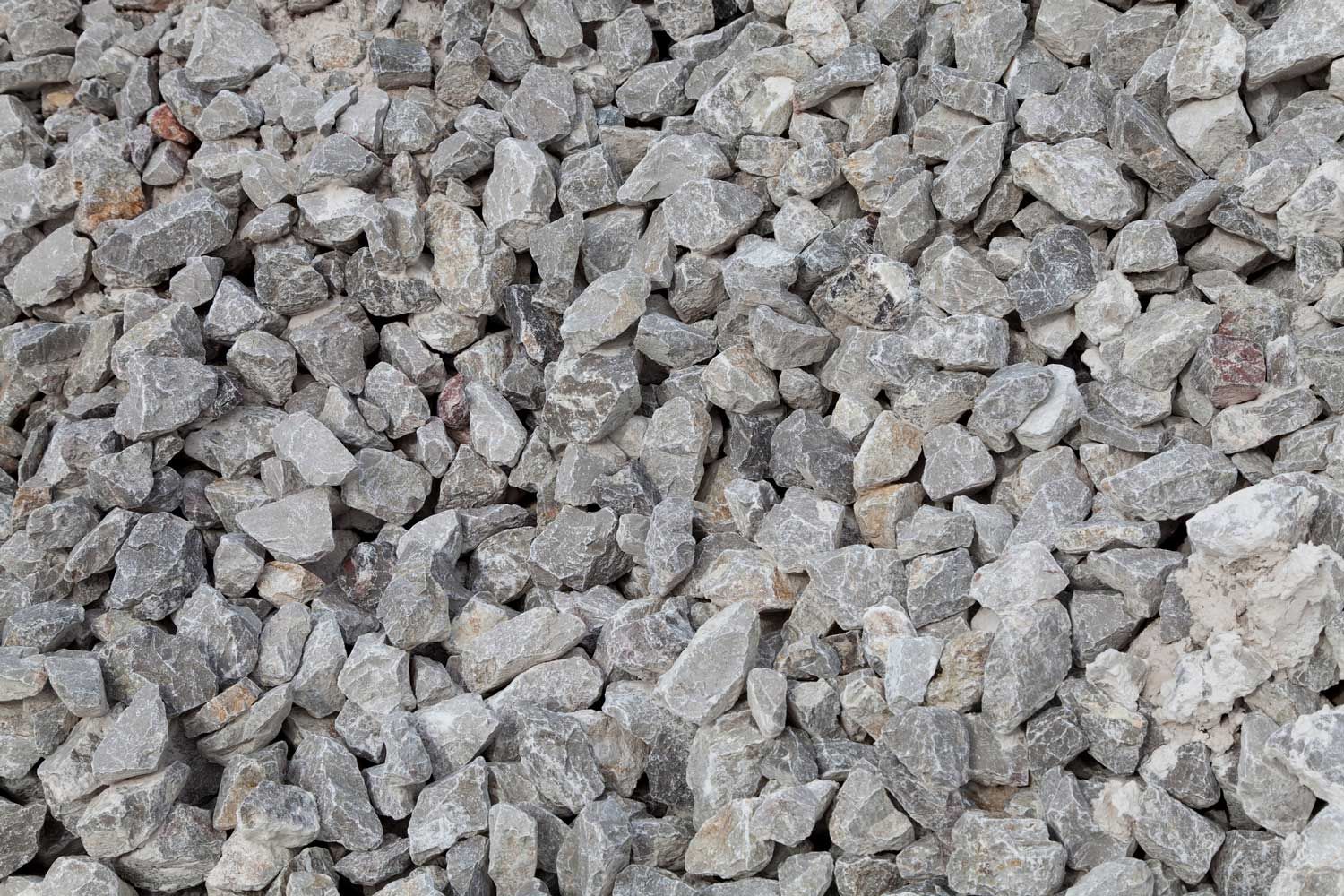 A pile of gravel is sitting on the ground.