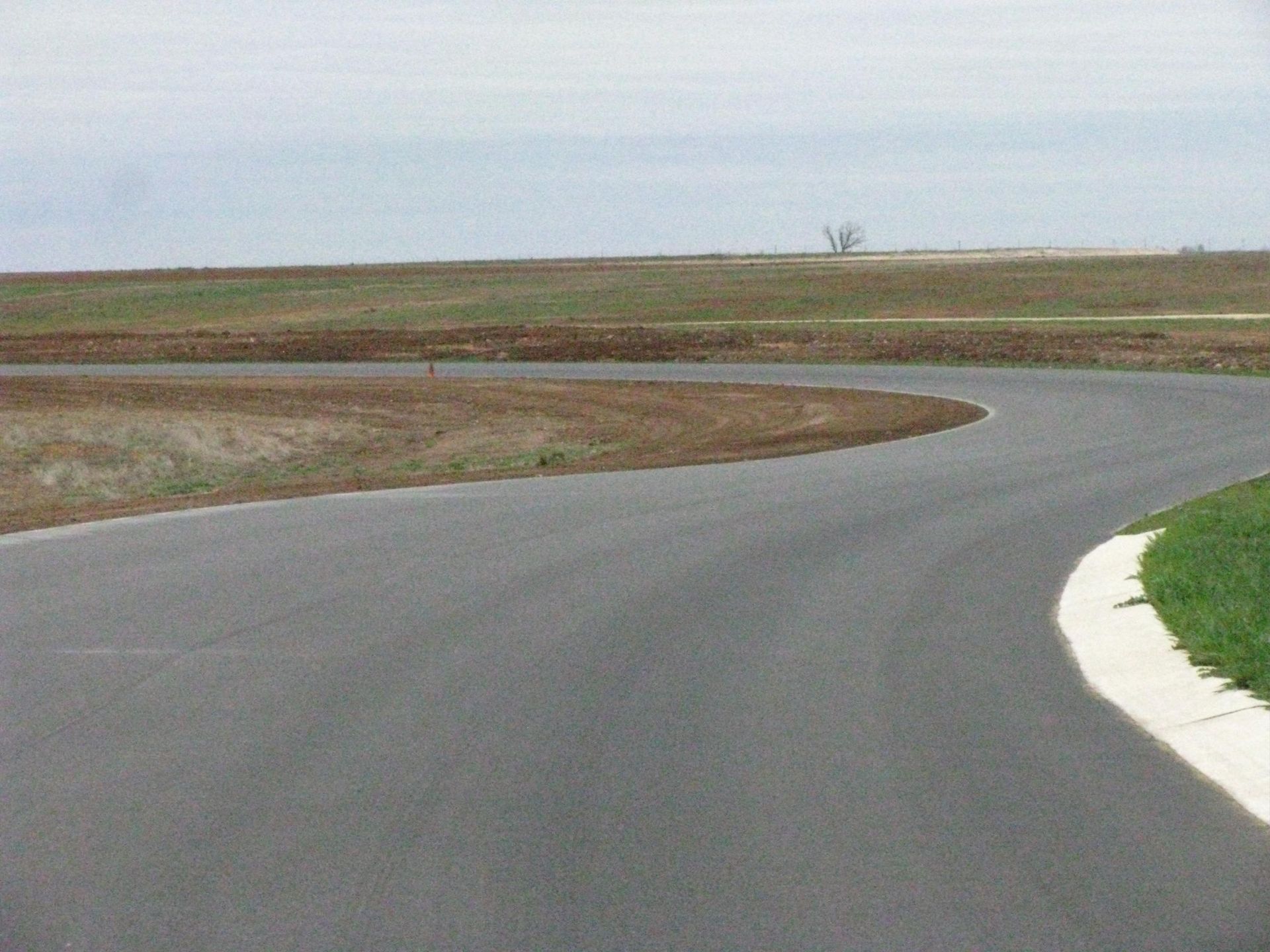 A road with a curve in the middle of it