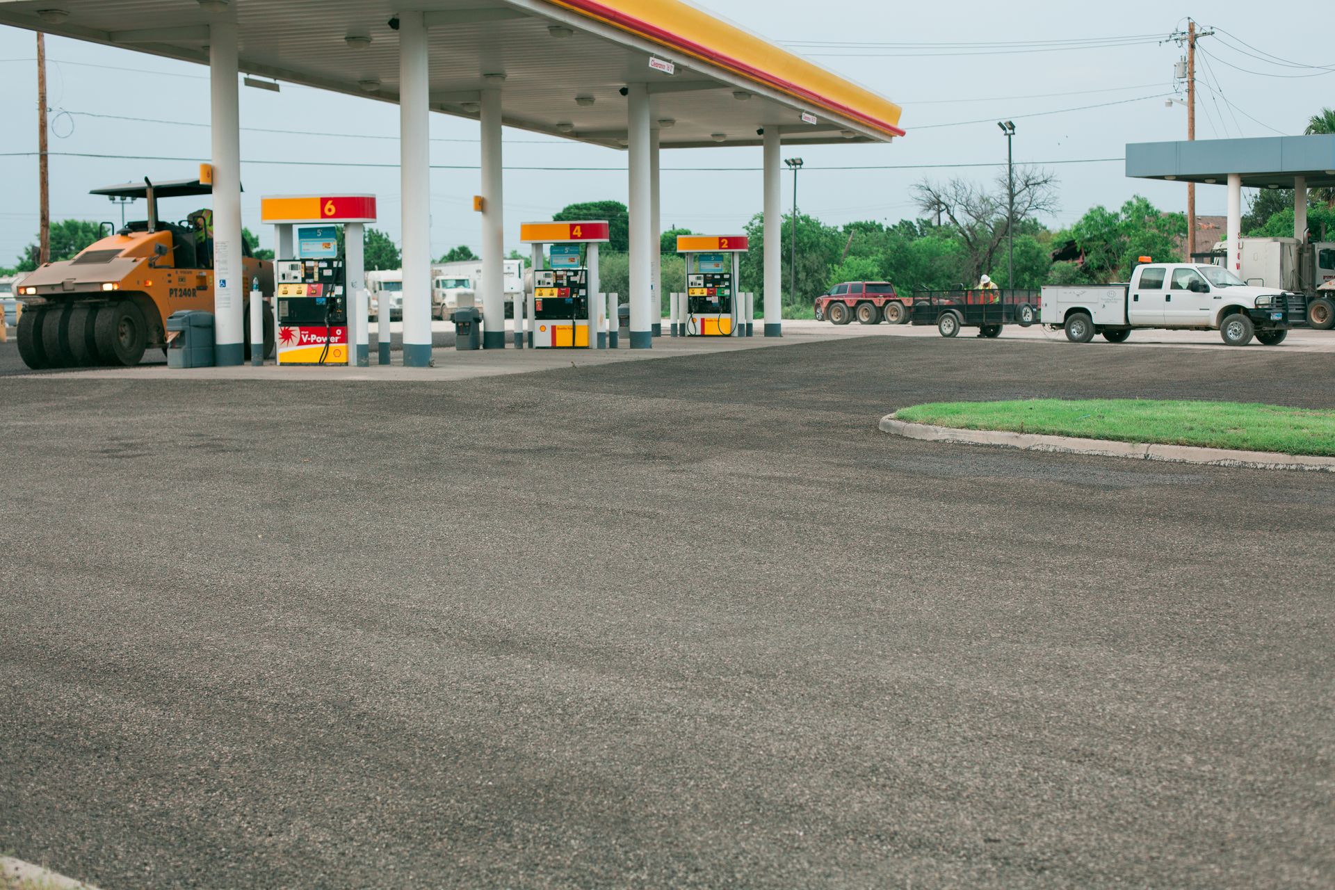 A gas station with a truck parked in front of it