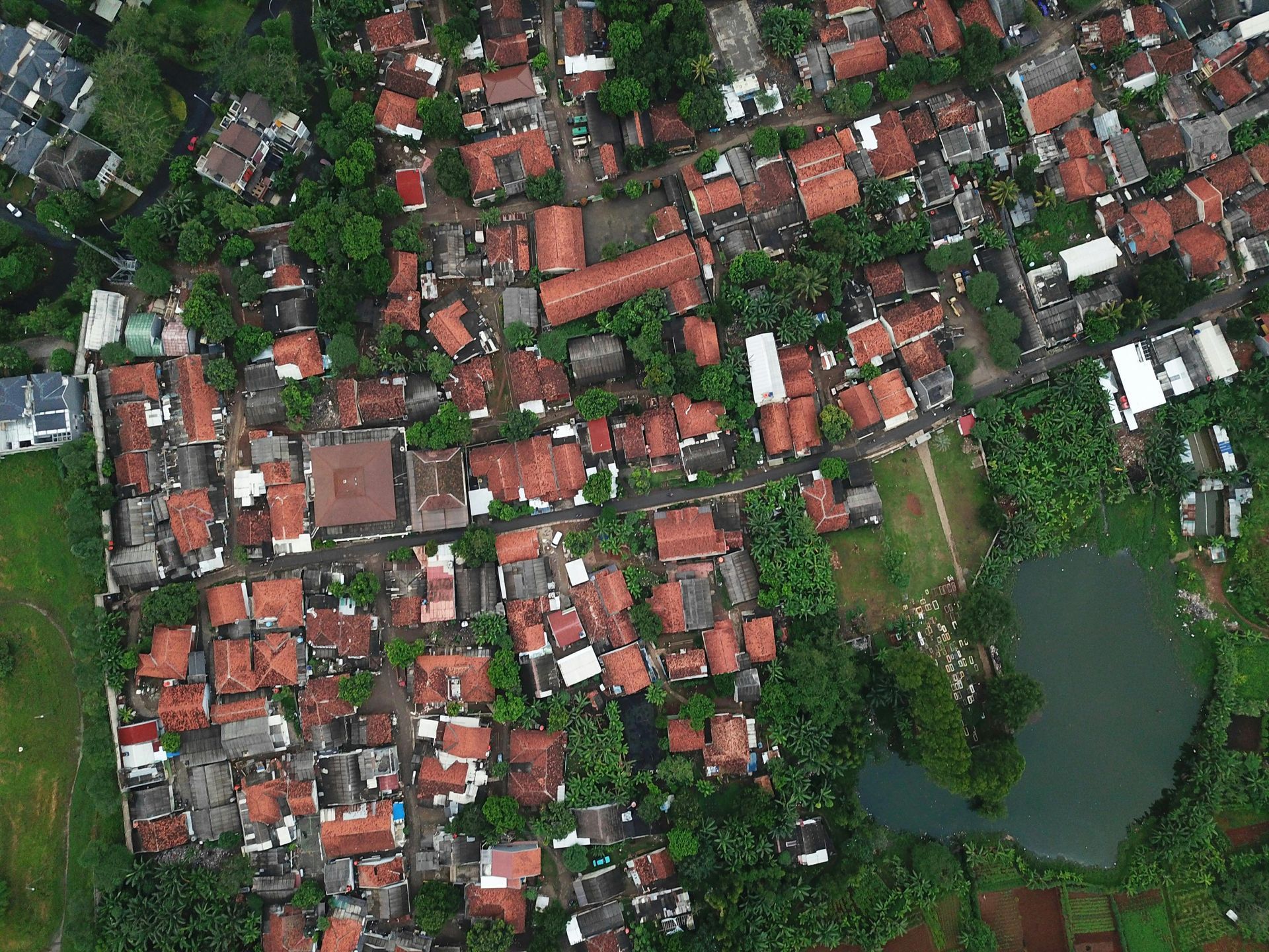 An aerial view of a residential area with lots of houses and trees.