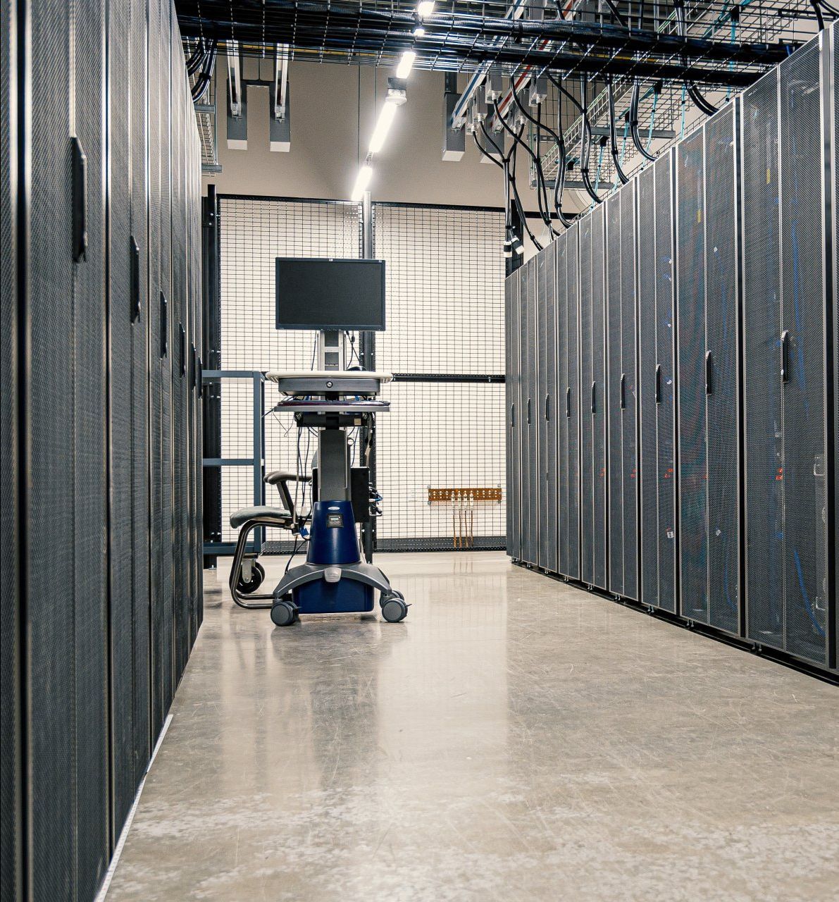 A row of servers are lined up in a server room