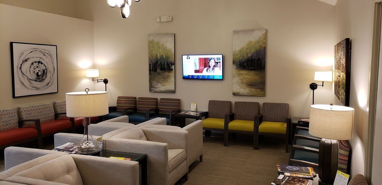 A living room filled with furniture and a flat screen tv.