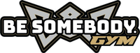 Logo for Be Somebody Gym, featuring bold white text and a tan "GYM" label over a silver geometric emblem.