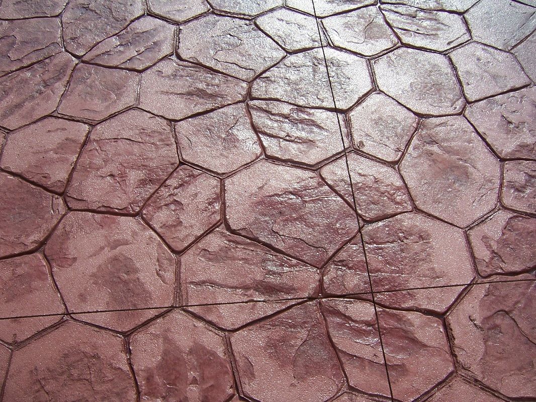 A close up of a brick floor with a geometric pattern