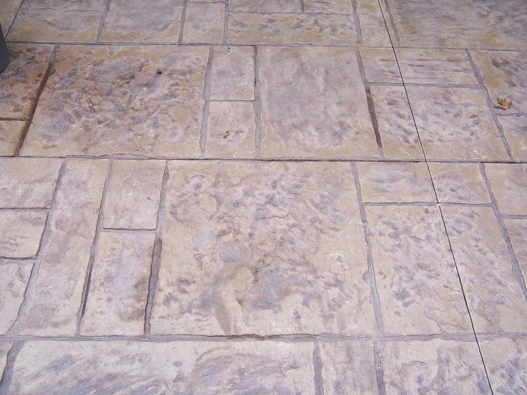 A close up of a brick floor with a grid pattern