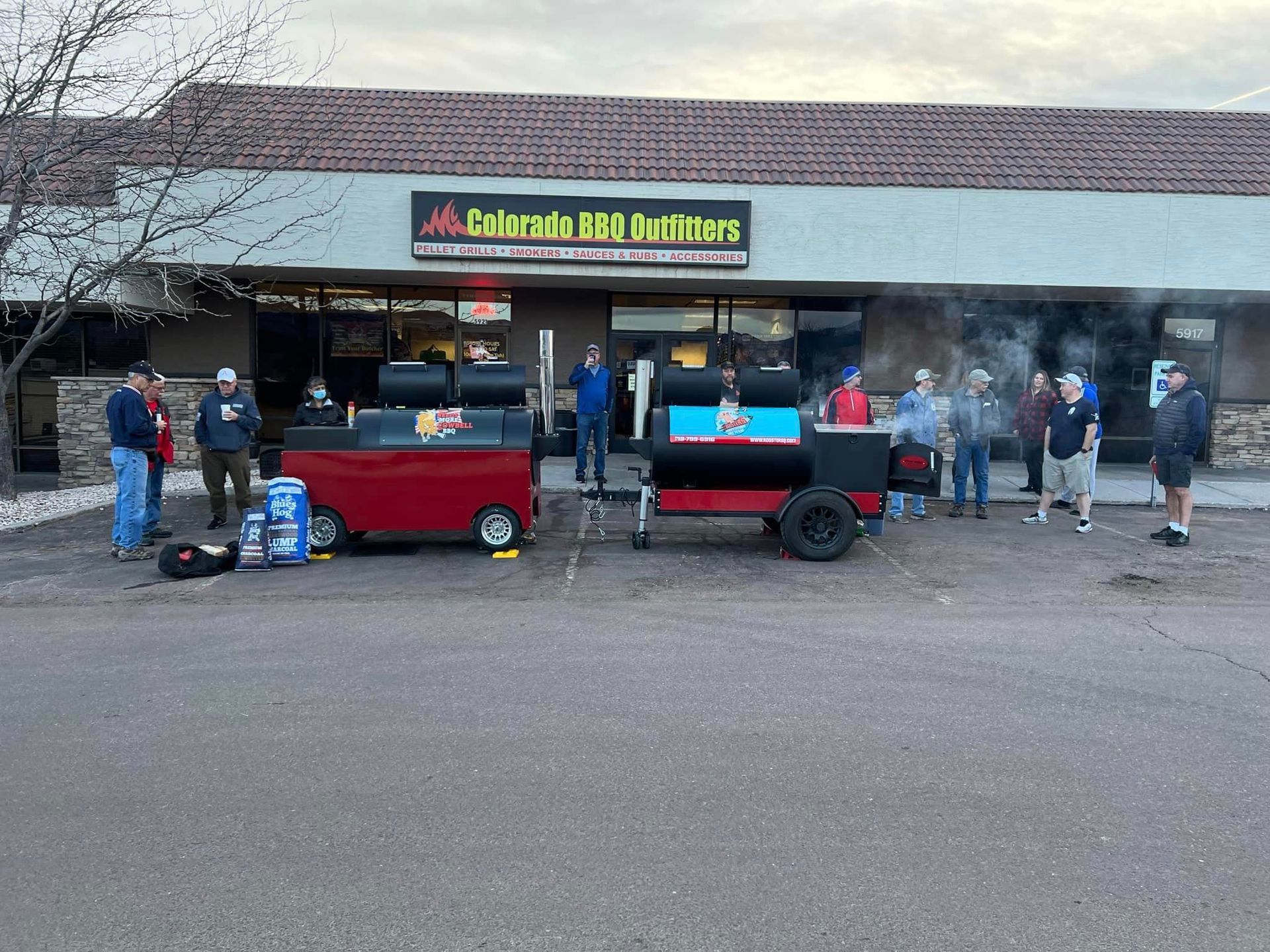 A group of people are standing in front of a building.