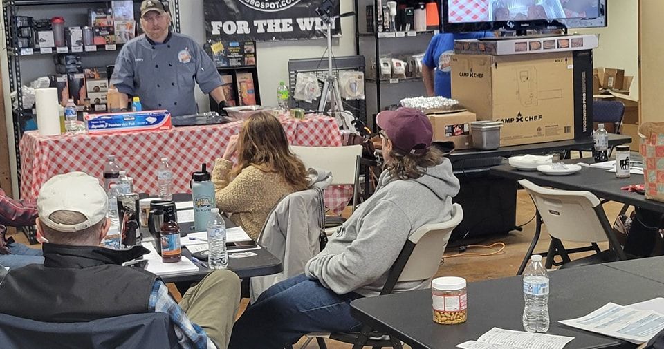 A group of people are sitting at tables in a room.