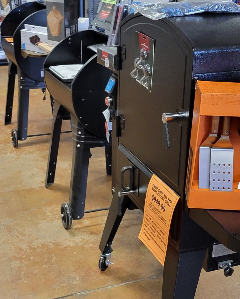 A black oven with a sign on it that says ' cooking ' on it