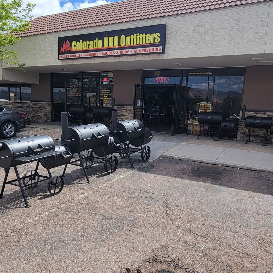 A store front with a sign that says colorado bbq outfitters
