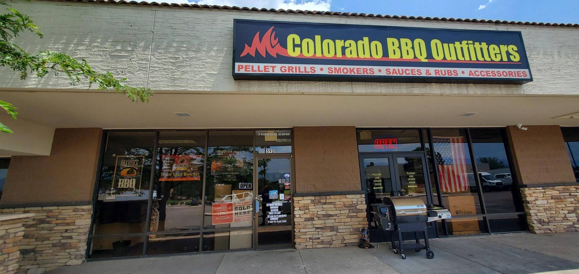 The front of a store called colorado bbq outfitters
