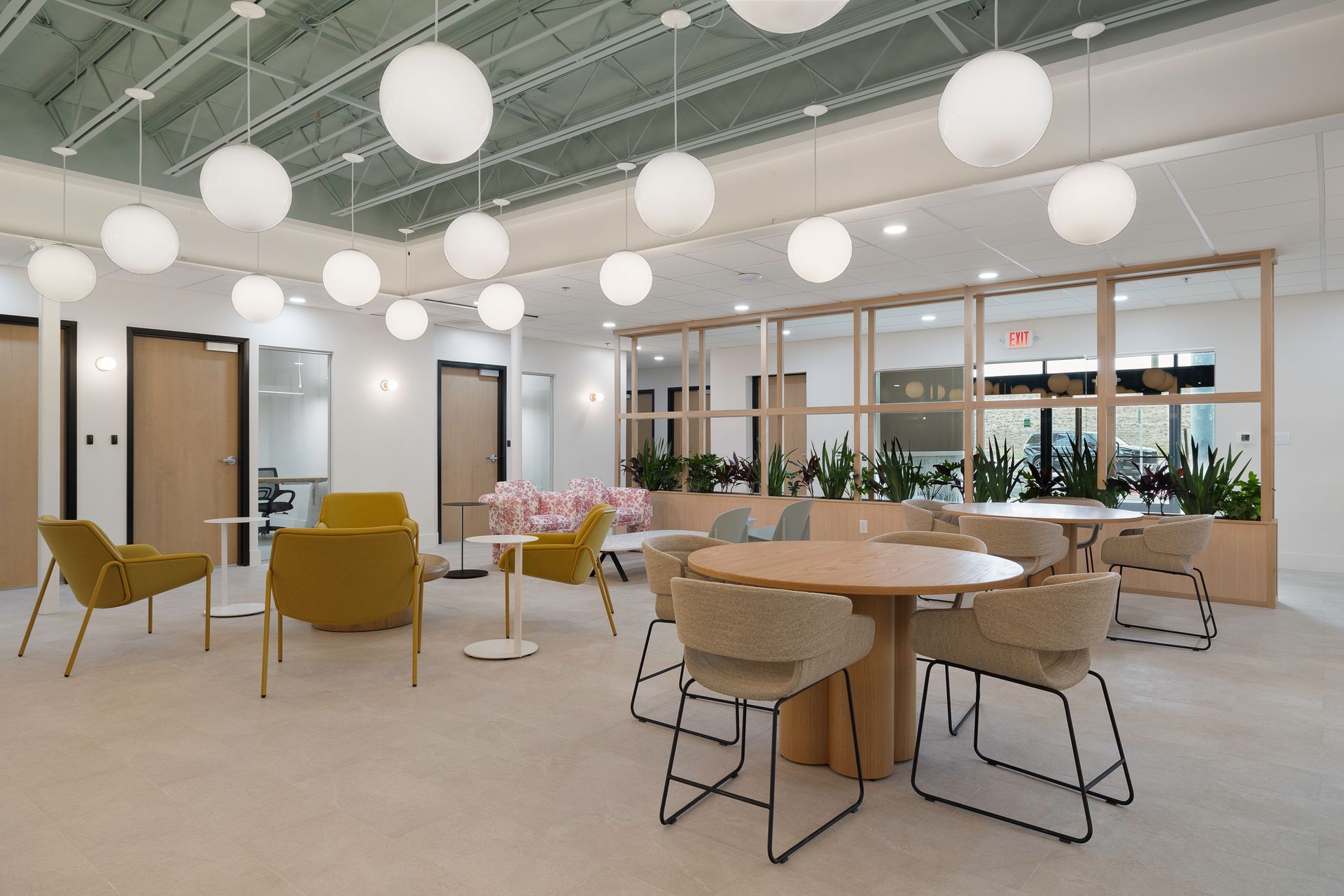 A large room with tables and chairs in it.