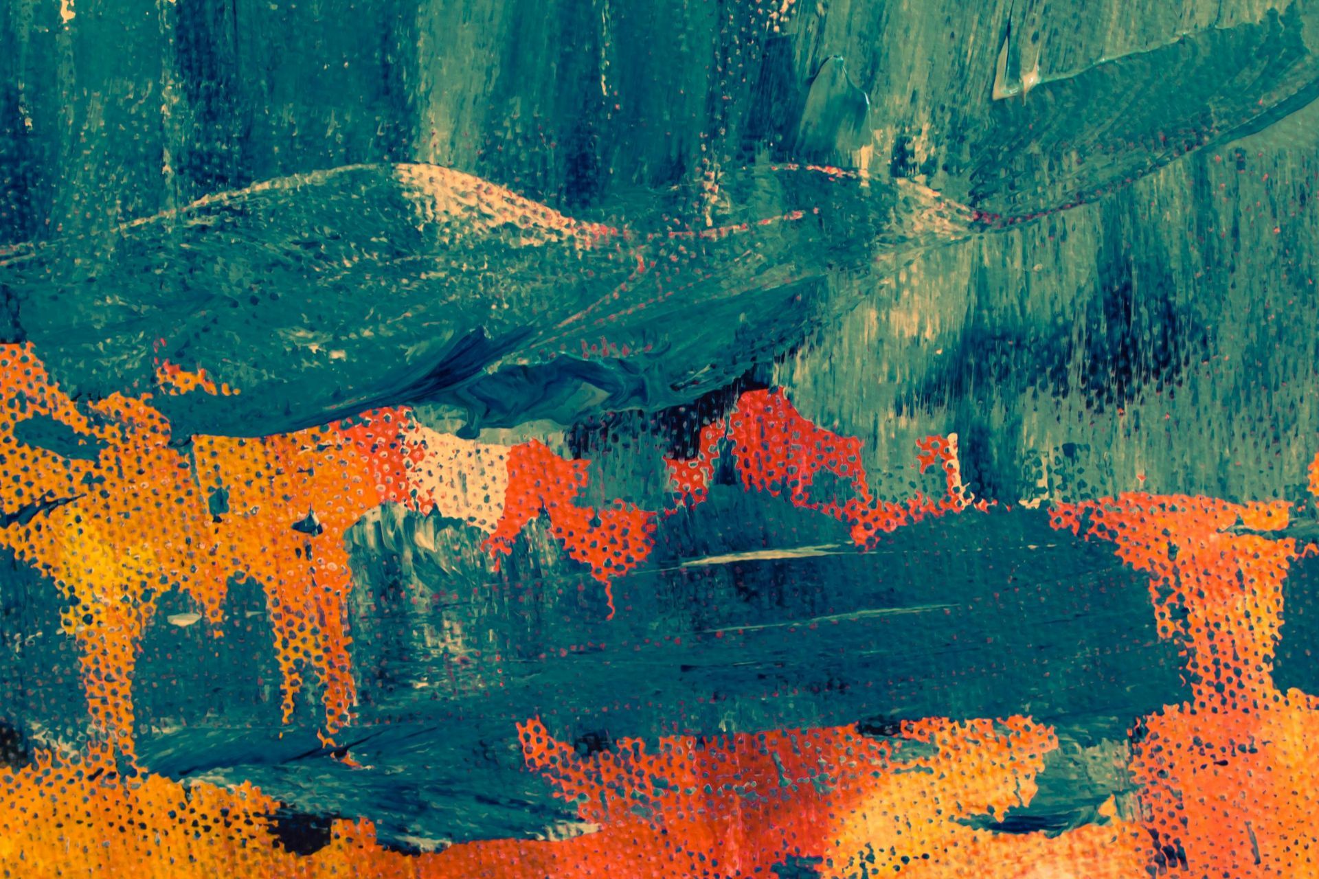 A close up of a colorful painting on a wall.