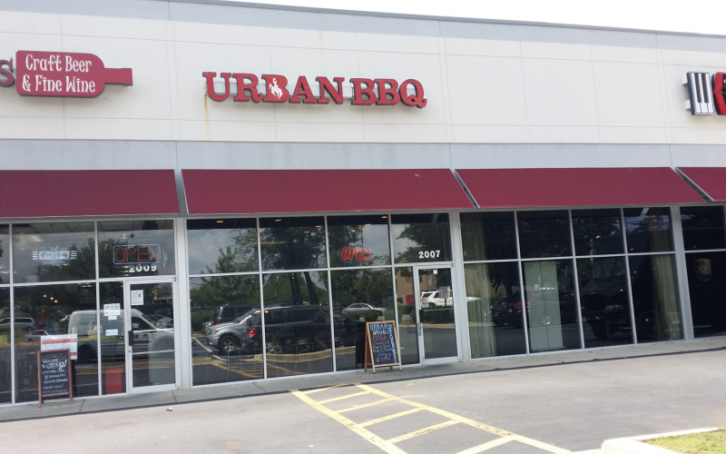A building with a sign that says urban bbq on it