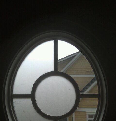 A round window with a circle in the middle of it