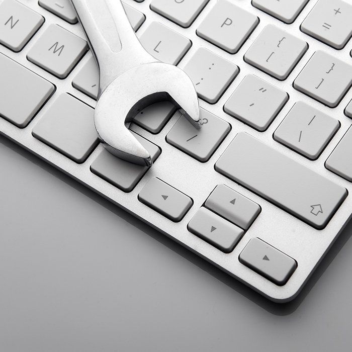 Spanner on a computer keyboard