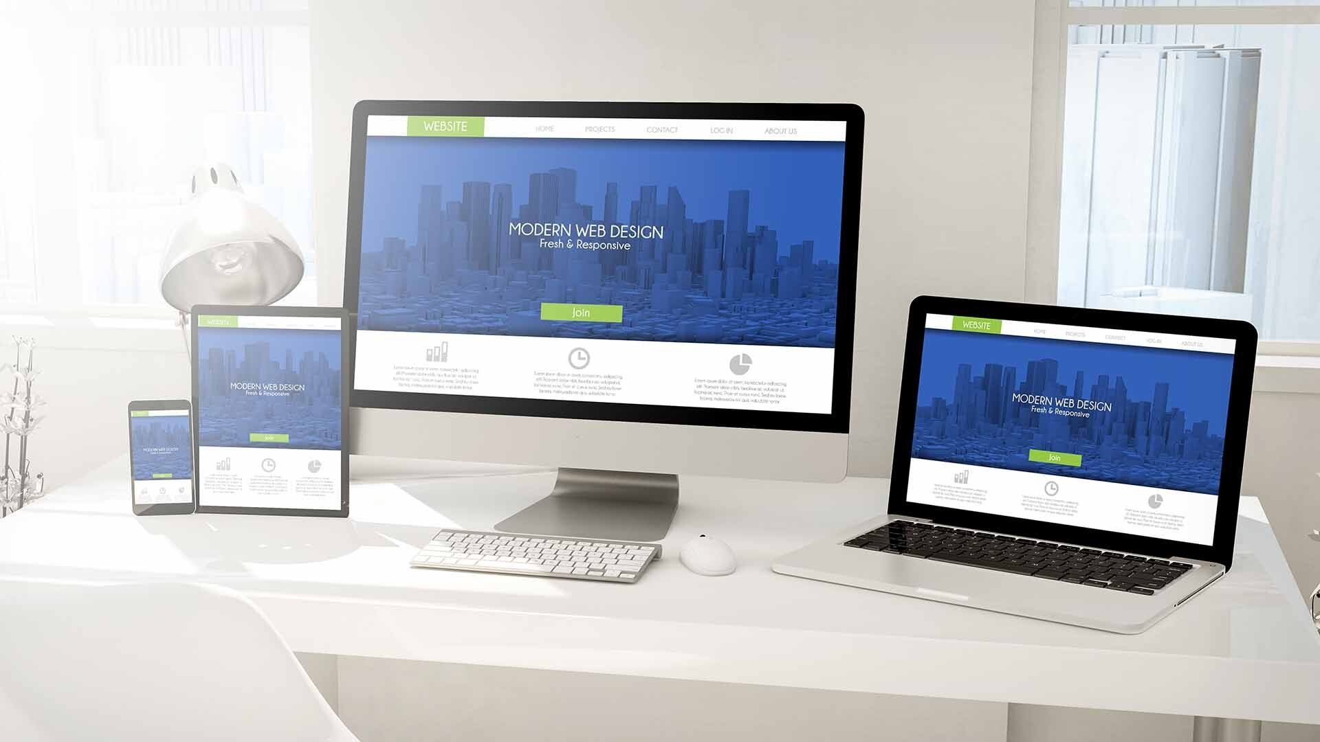 Website design shown on phone, tablet, laptop and desktop