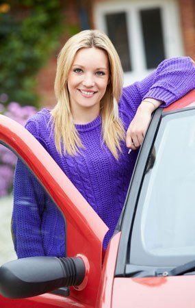 a lady getting out of the car