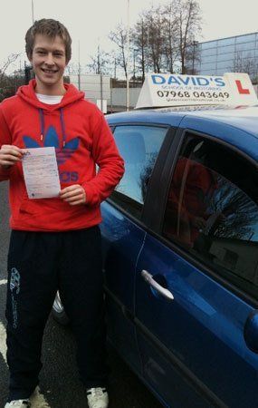 a man standing next to the car