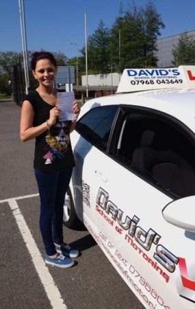a lady showing her pass certificate