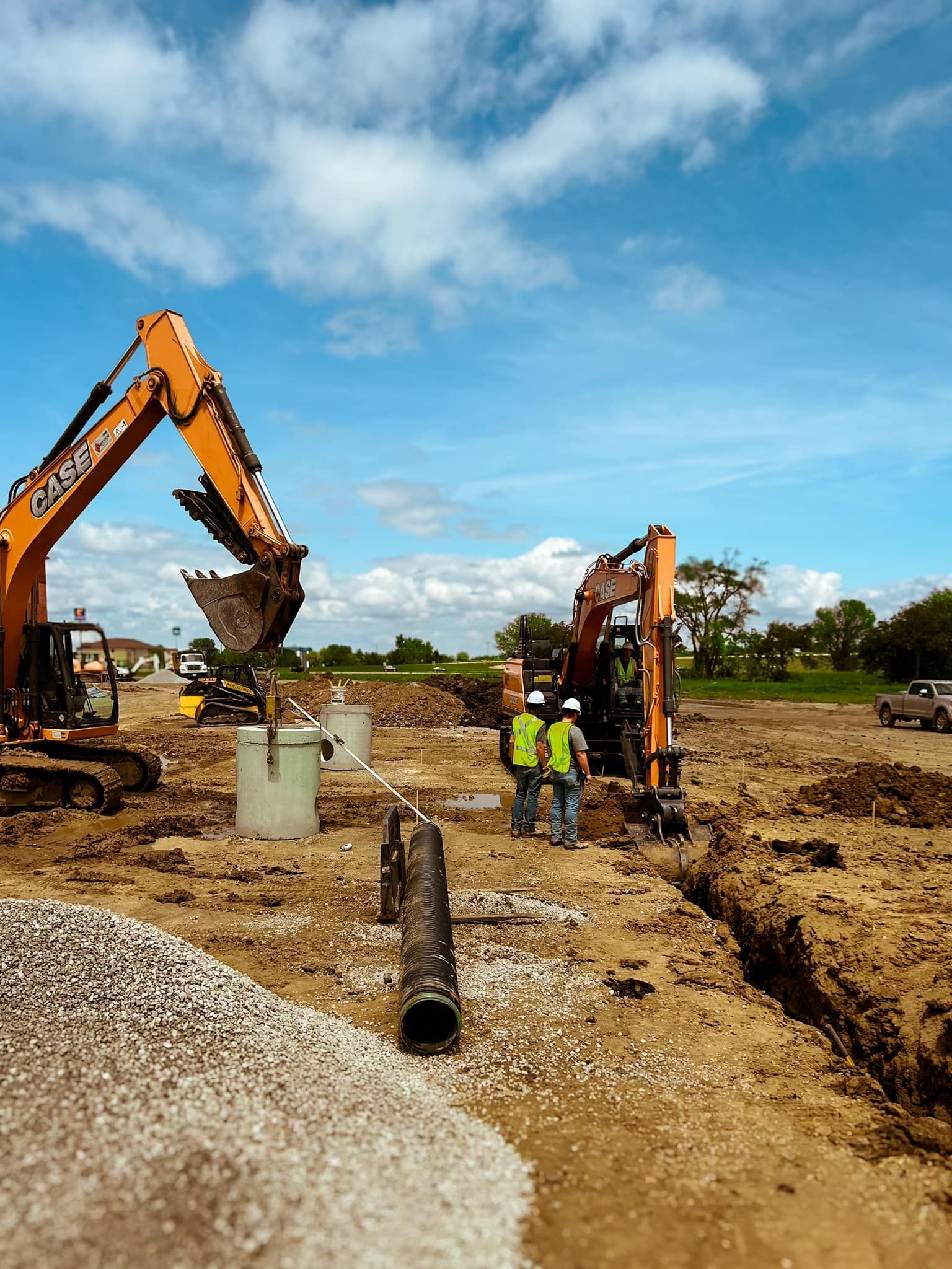 A group of construction workers are working on a construction site.