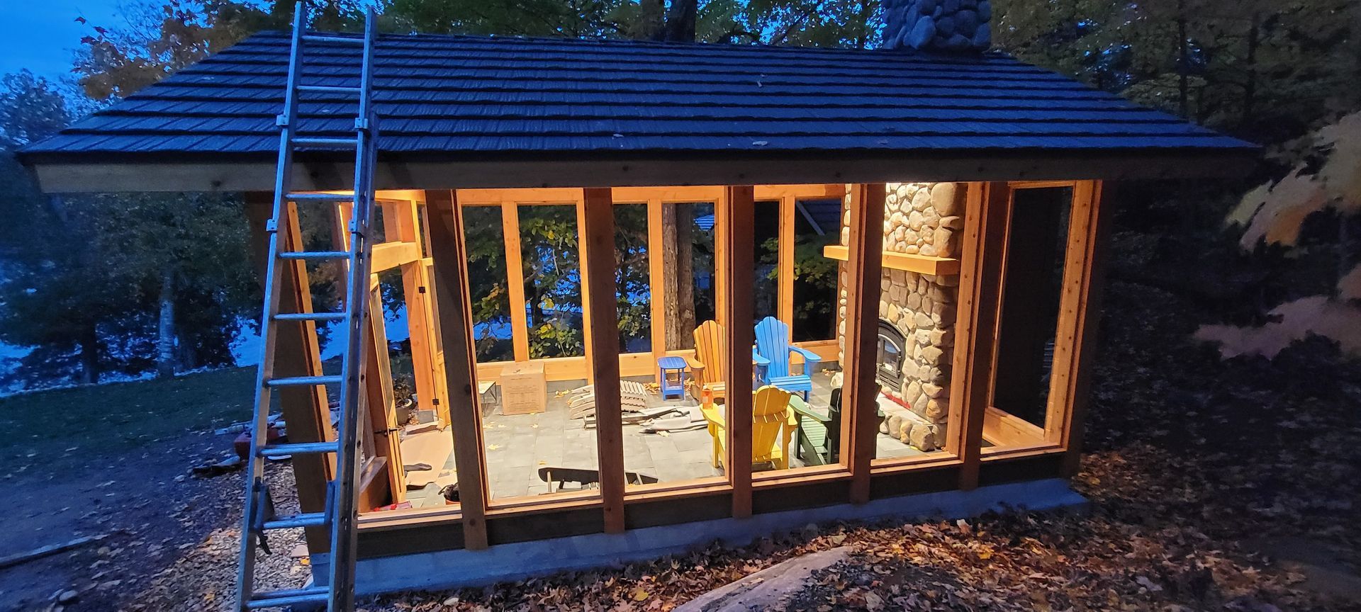 A wooden structure is being built with a ladder.