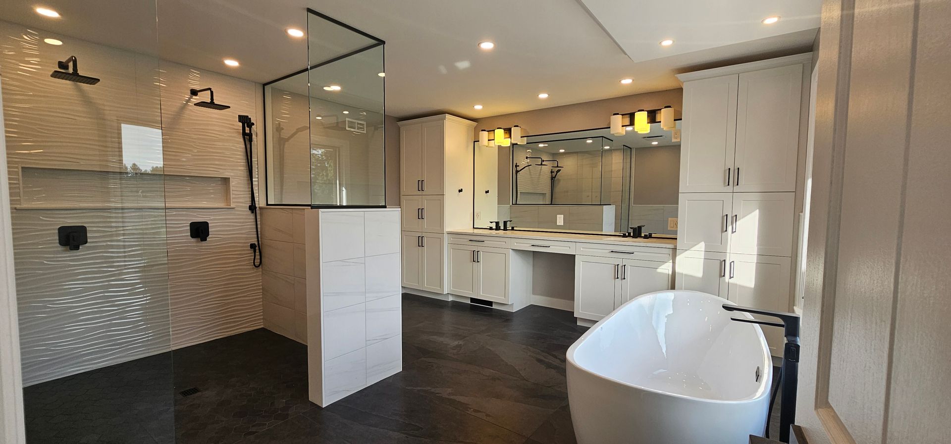 A bathroom with a tub , shower , sink and mirror.