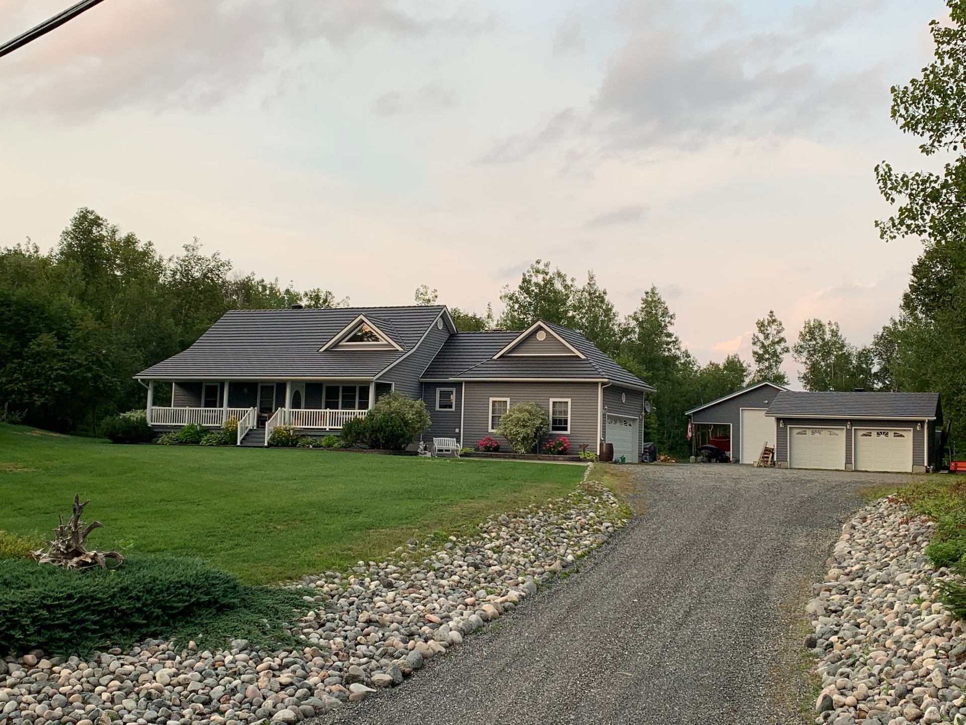 A large house with a driveway leading to it