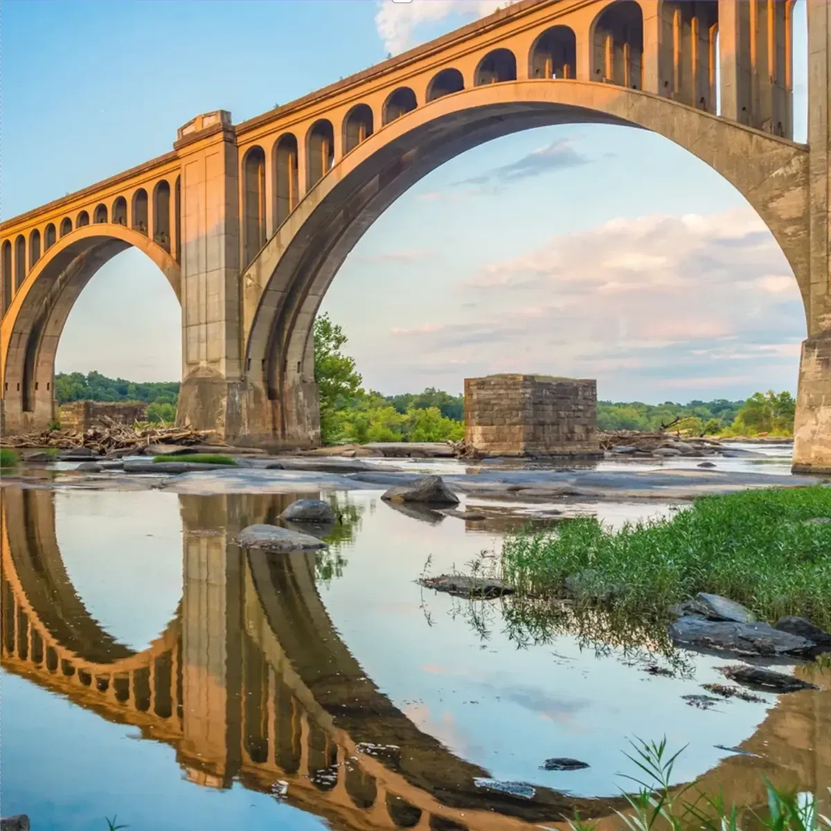 Historic bridge over the James River symbolizing connection and enduring legacy in the Richmond community