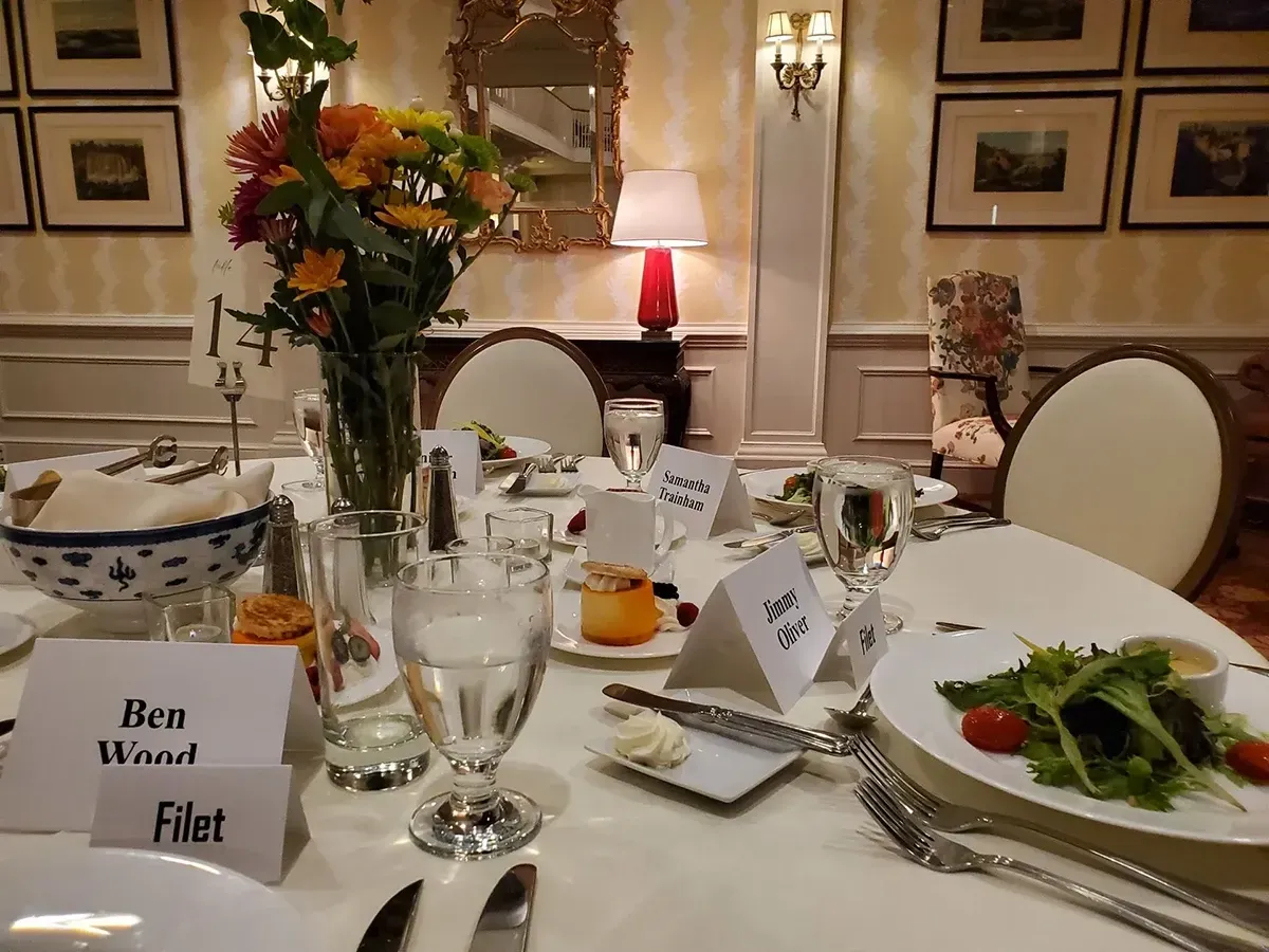 Elegantly set dinner table prepared for guests at a Richmond Christian Foundation Gala