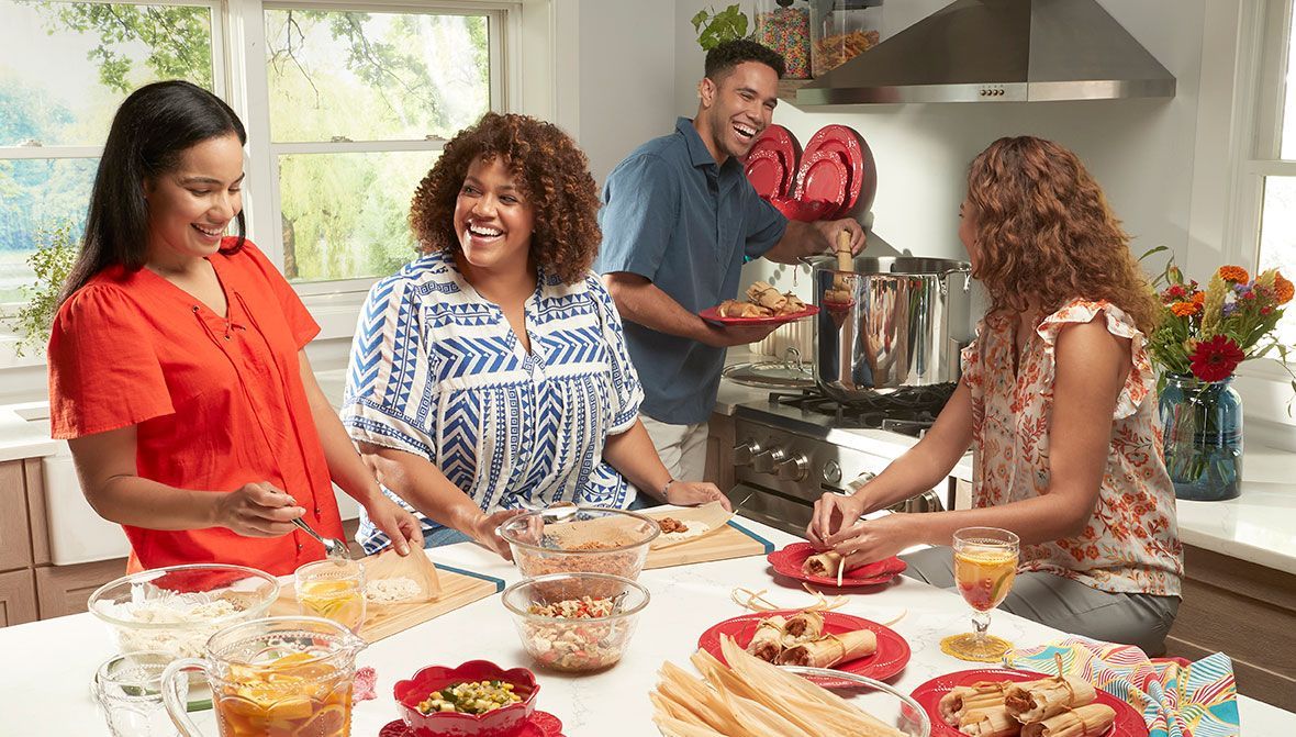 There are many different types of plates and bowls on the table.