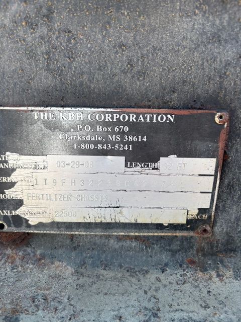Metal plate with the KEH Corporation information and serial numbers, attached to a surface.