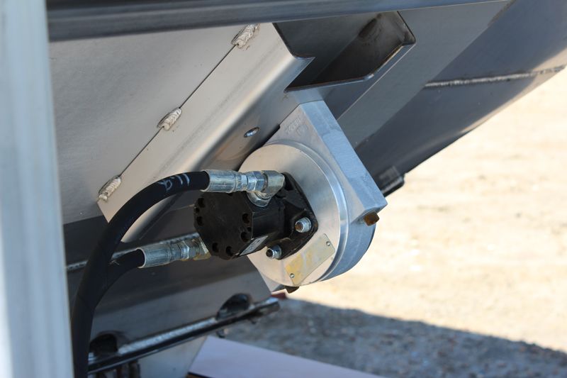 A close up of a machine with a hose attached to it