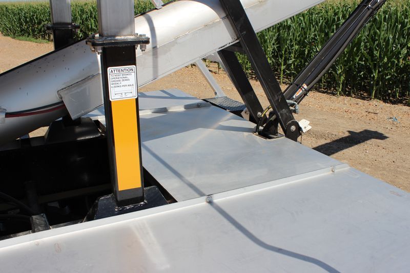 A yellow and black pole with the word safety on it