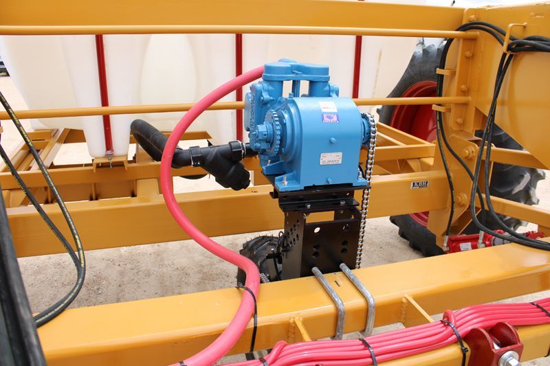 A blue pump with a red hose attached to it