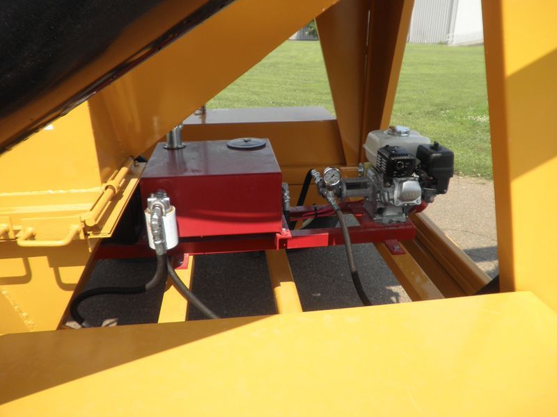 A yellow machine with a red box and a red engine