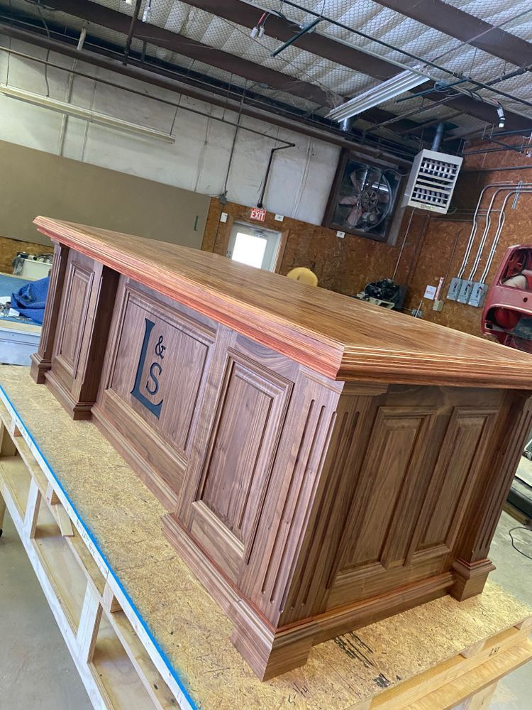 Wooden desk with carved panels and a Texas 