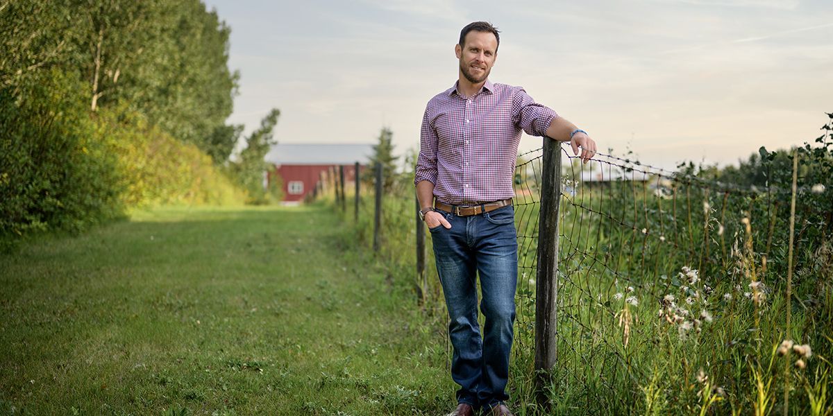 Mike Holden, Vision Agriculture/Commercial Specialist poses on a farm near Camrose, Alberta.