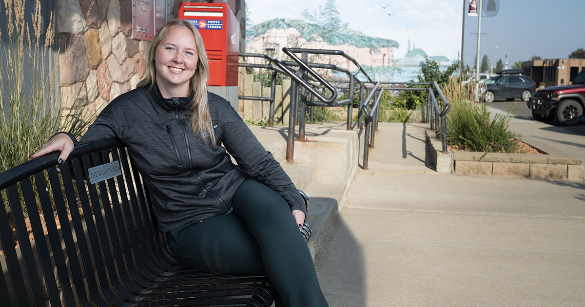 Alissa Craigie poses for a photo outside of the Vision Credit Union branch in Castor, Alberta.