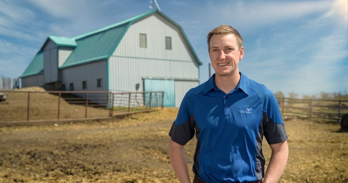 Austyn Fowler standing on a farm in Viking, Alberta
