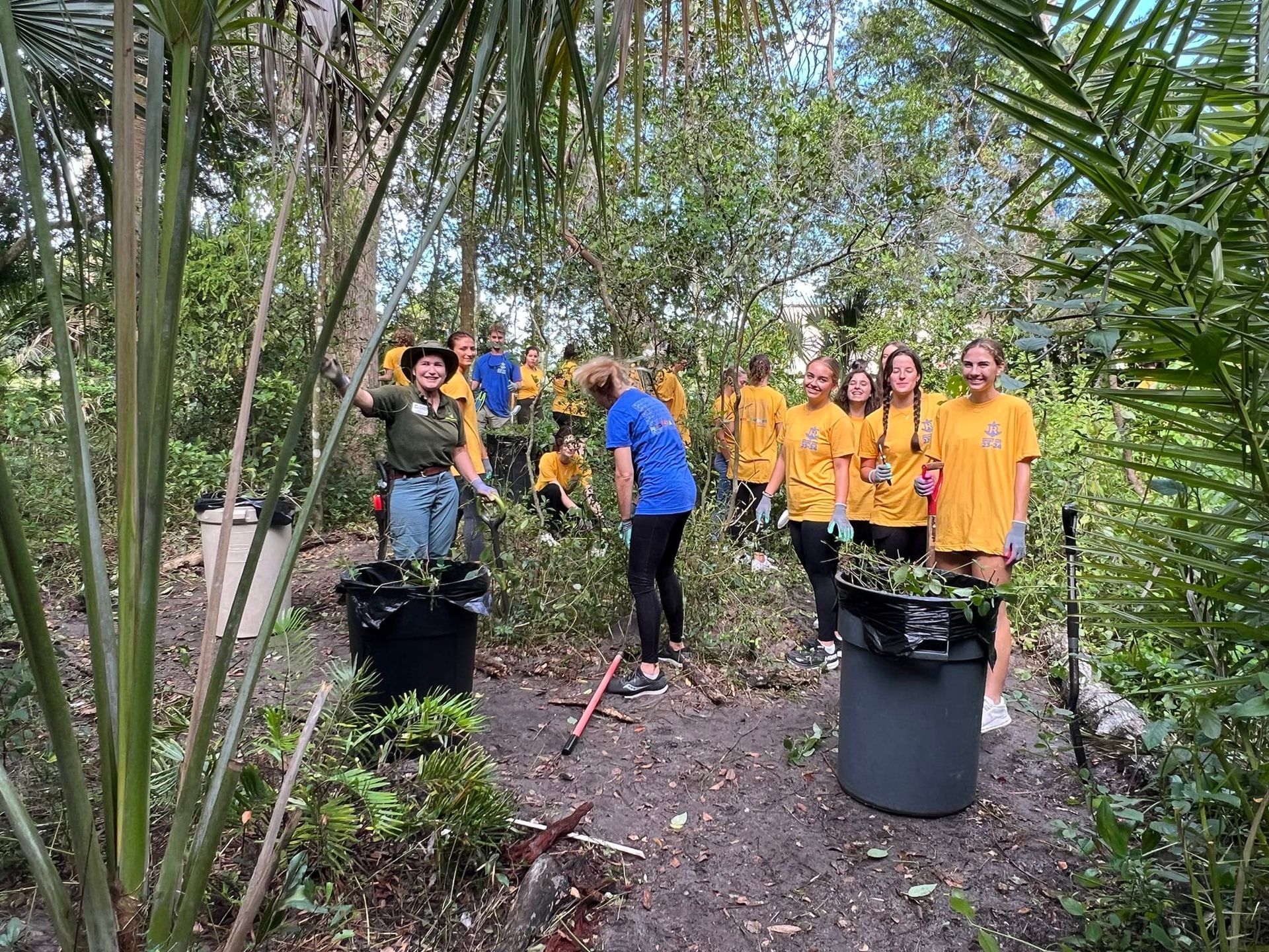 Rollins SPARC Volunteers cleaning out invasive plants.