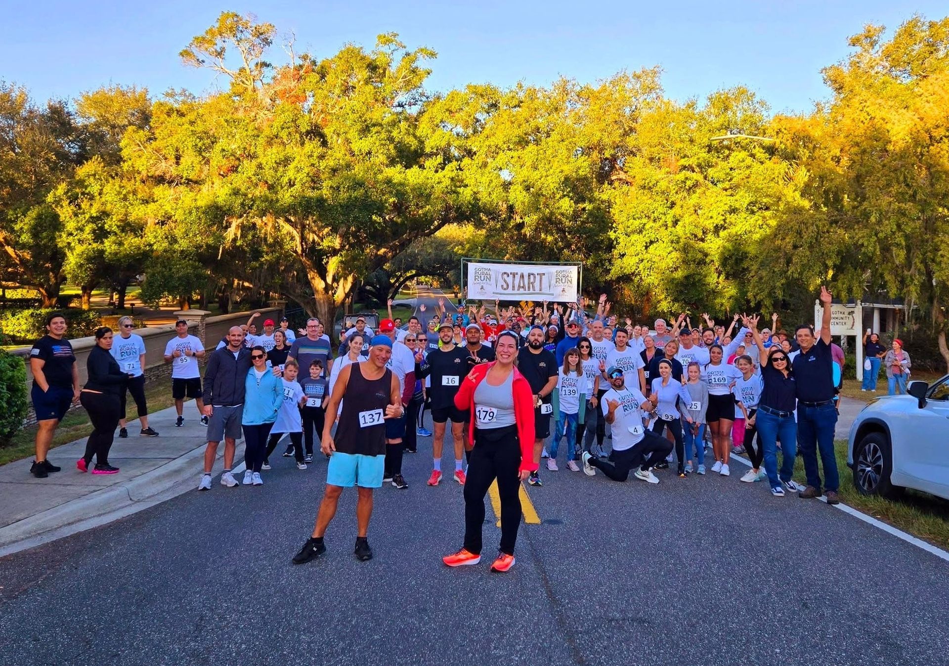 Runners and walkers take a group pic before the first annual Gotha Rural 5K Run
