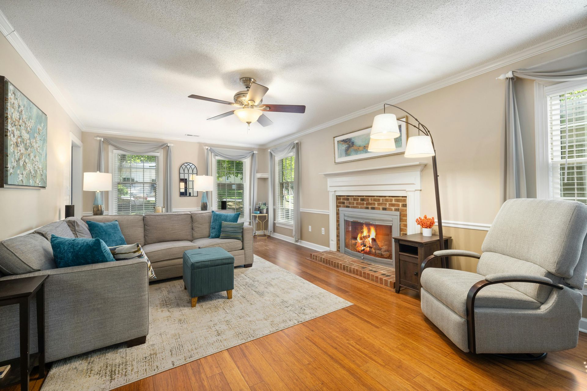 A living room filled with furniture and a fireplace.