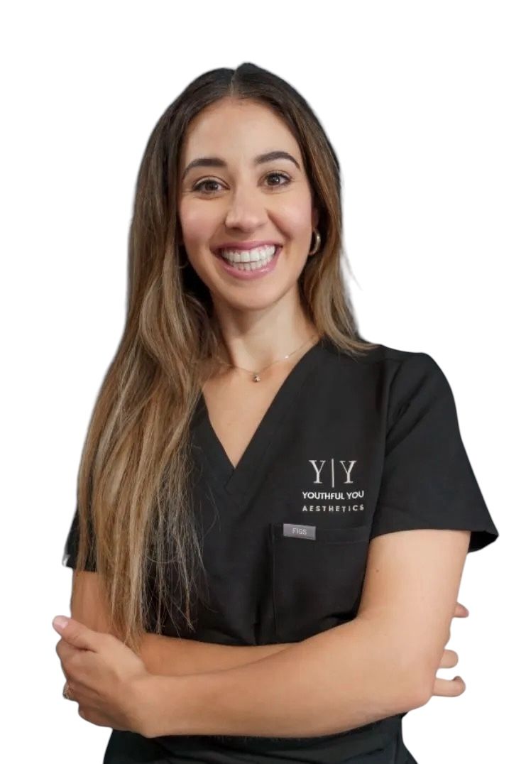 A woman wearing a black scrub top with the word yiy on it