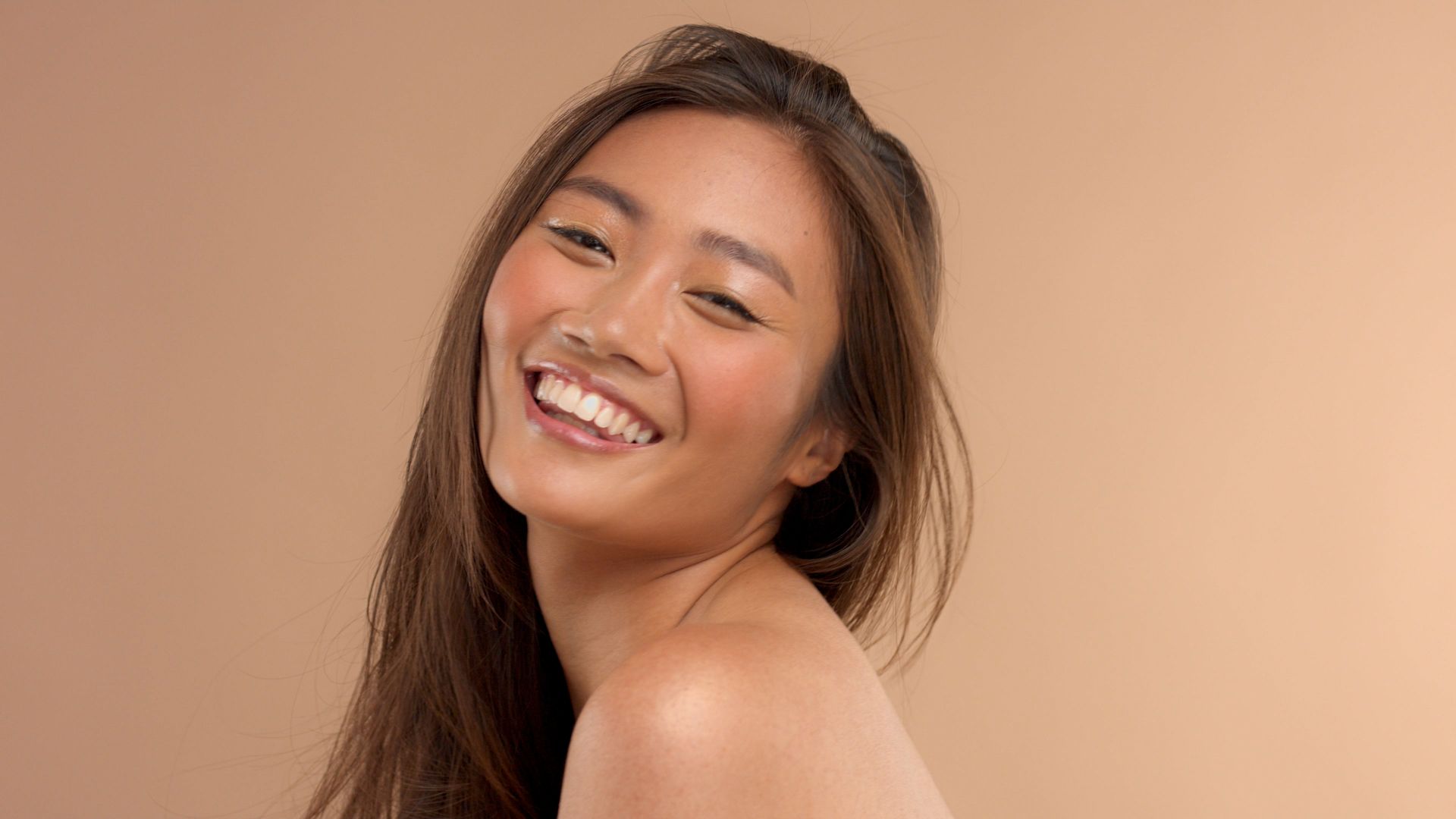 thai-asian-model-with-natural-makeup-beige-background.jpg
