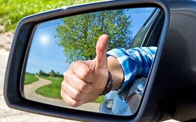 Thumbs Up in Side Mirror — Auto Glass Services in Dudley, MA