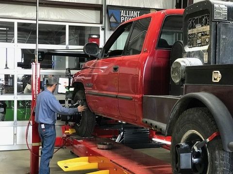 Diesel Repair — Mechanic Pouring Diesel on Engine in New Braunfels, TX
