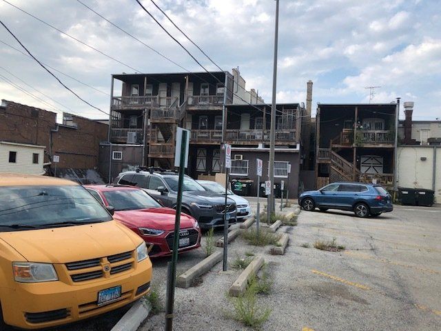 Exterior and parking lot of 710-716 Main Street.