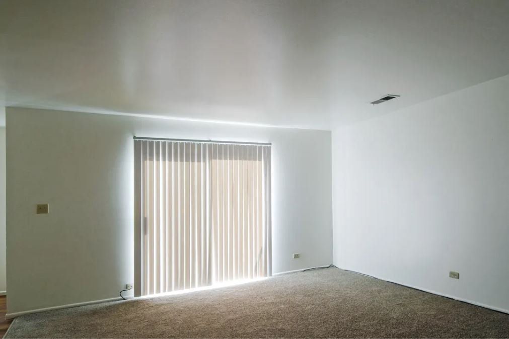 Living room with sliding door to outside.